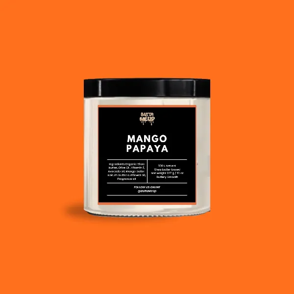 A Buttameup Mango Papaya shea butter jar on a bright orange background