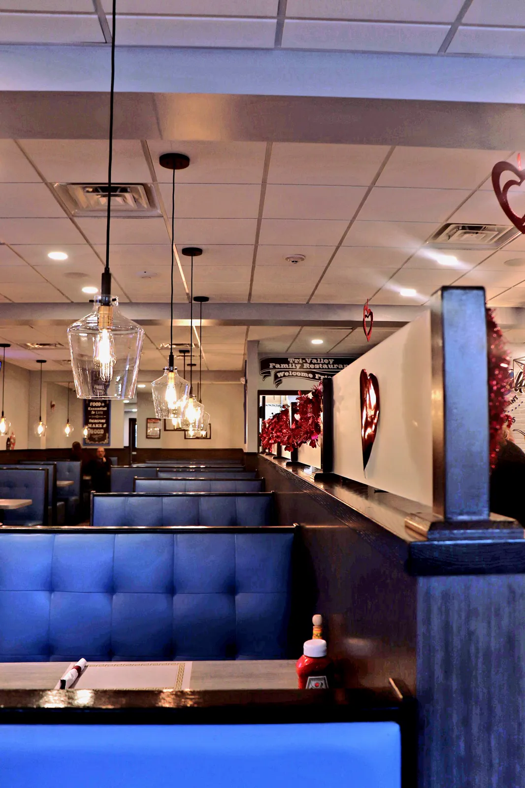 Restaurant dining room with blue booths