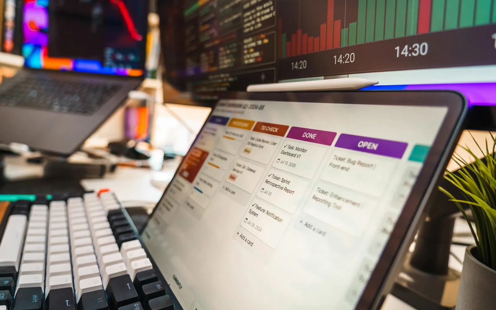 A tablet showing a project management board on a desk