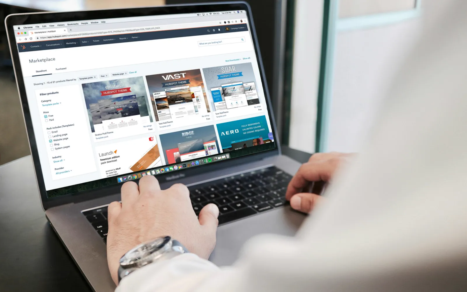 A person working on a website dashboard on a laptop